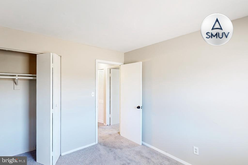 1504 Upshire Road, Unit F2 Baltimore, MD 21218 - Photo 11 of 22 a view of water heater room with empty racks