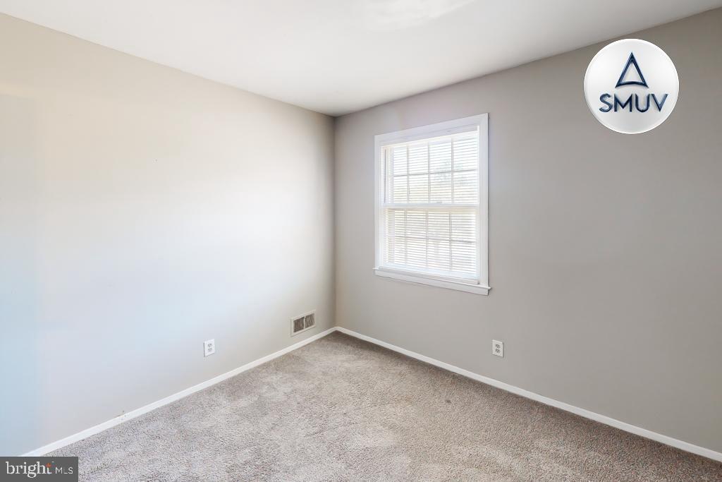 1504 Upshire Road, Unit F2 Baltimore, MD 21218 - Photo 15 of 22 an empty room with a window