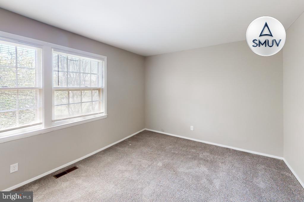 1504 Upshire Road, Unit F2 Baltimore, MD 21218 - Photo 20 of 22 an empty room with a window