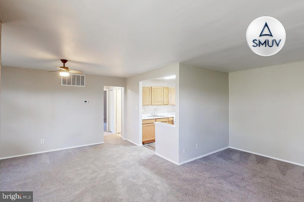 1504 Upshire Road, Unit F2 Baltimore, MD 21218 - Photo 2 of 22 an empty room with a view of a kitchen