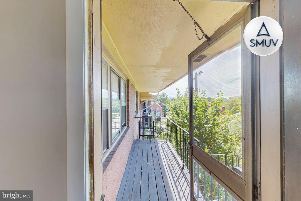 1504 Upshire Road, Unit F2 Baltimore, MD 21218 - Photo 4 of 22 a view of a hallway with wooden floor