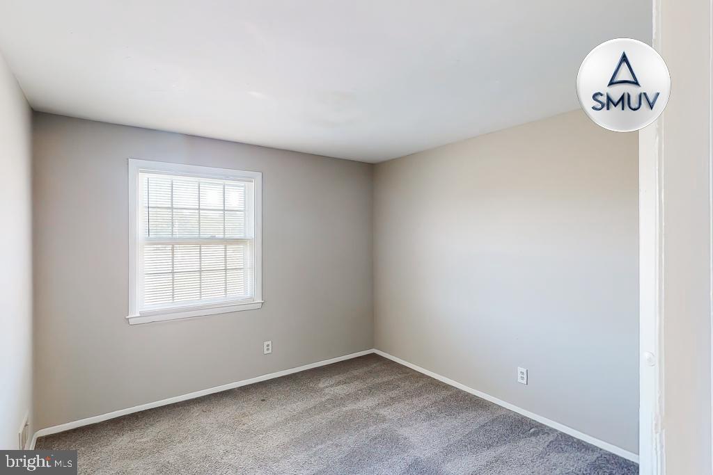 1504 Upshire Road, Unit F2 Baltimore, MD 21218 - Photo 10 of 22 an empty room with a window