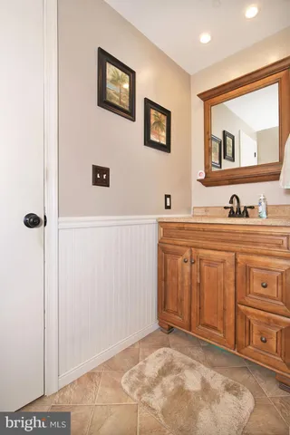 a bathroom with a sink a vanity and a mirror