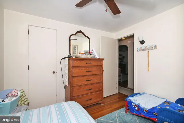 a bedroom with bed and a chandelier