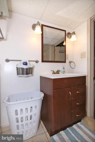 a large bed sitting in a bedroom next to a window