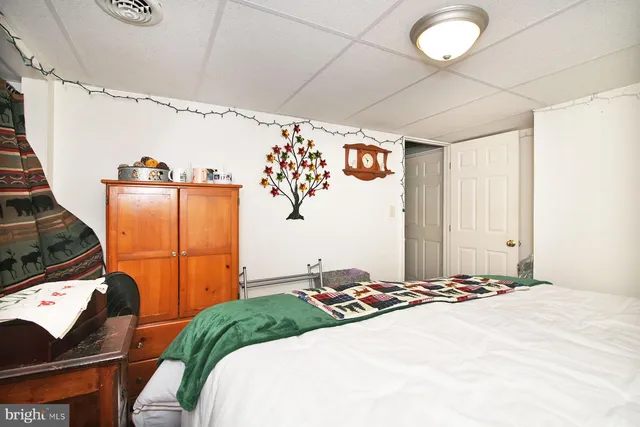 a bedroom with furniture and a window