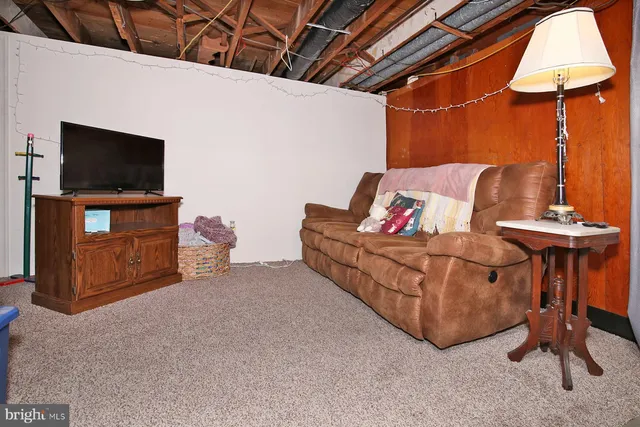 a room with furniture and flat screen tv