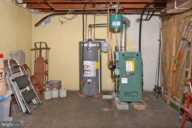 a view of storage and utility room with stairs