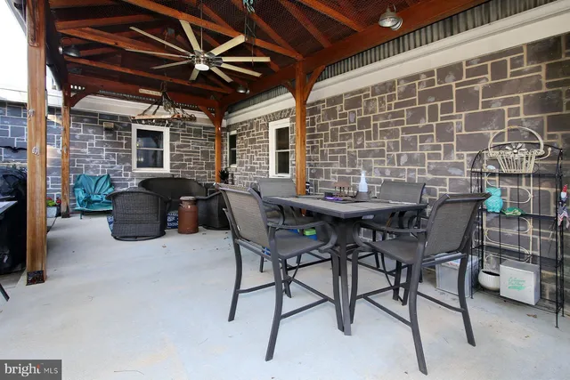 a view of a backyard with sitting area