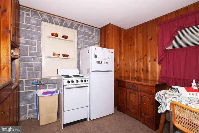 a front view of house with outdoor seating