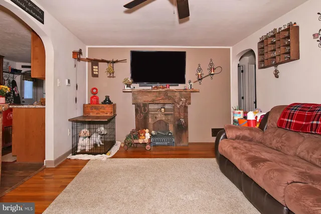 a living room with furniture and a flat screen tv