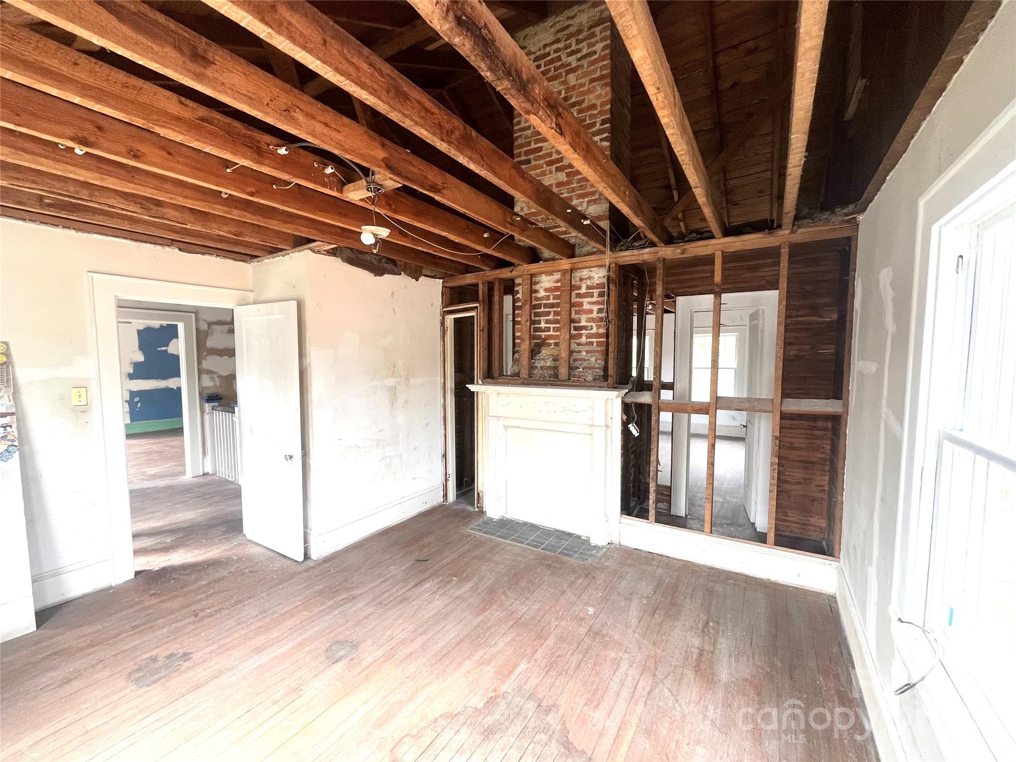 308 Elm Street Lancaster, SC 29720 - Photo 12 of 33 a view of empty room with wooden floor