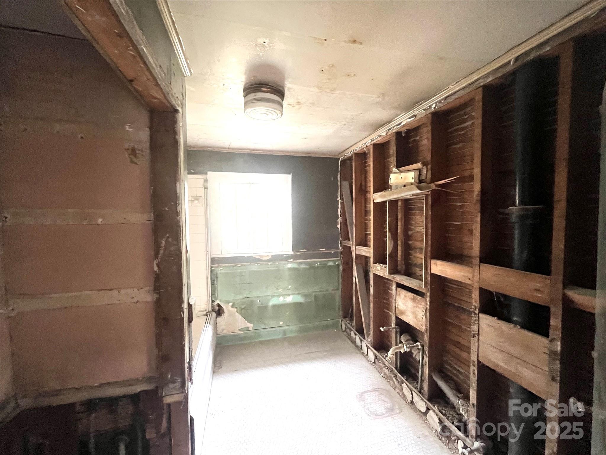 308 Elm Street Lancaster, SC 29720 - Photo 15 of 33 a view of walk in closet and natural light