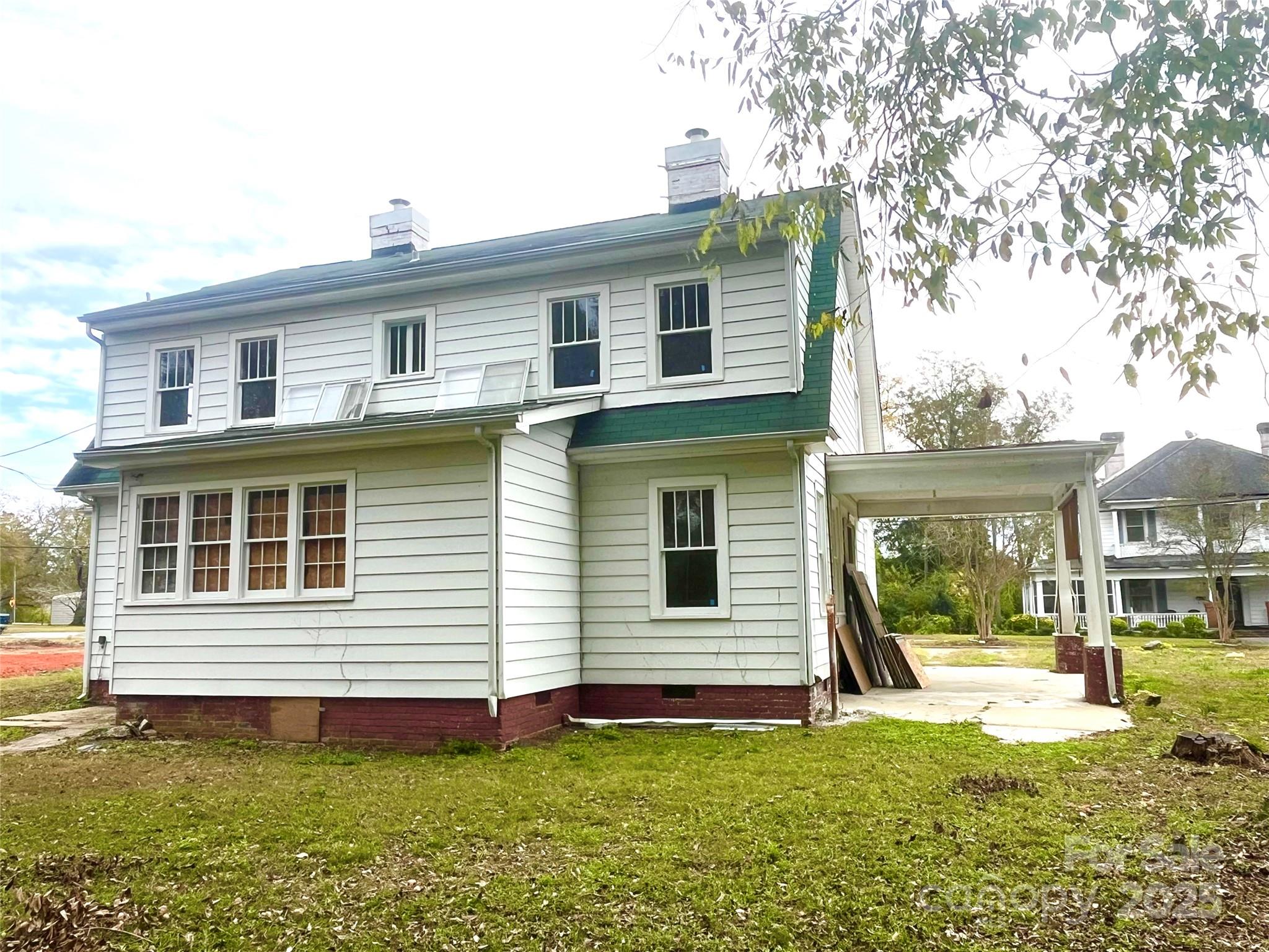 308 Elm Street Lancaster, SC 29720 - Photo 23 of 33 a front view of a house with a yard