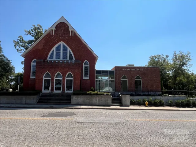a swimming pool with outdoor seating and yard