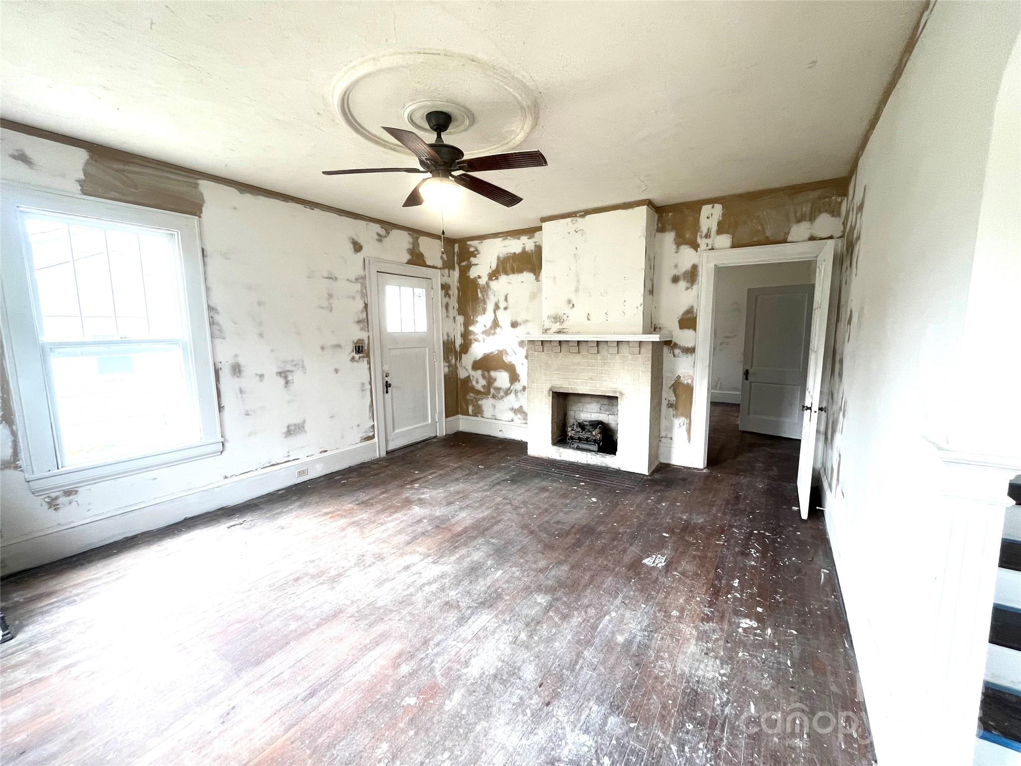 308 Elm Street Lancaster, SC 29720 - Photo 4 of 33 a view of a livingroom with a ceiling fan and window