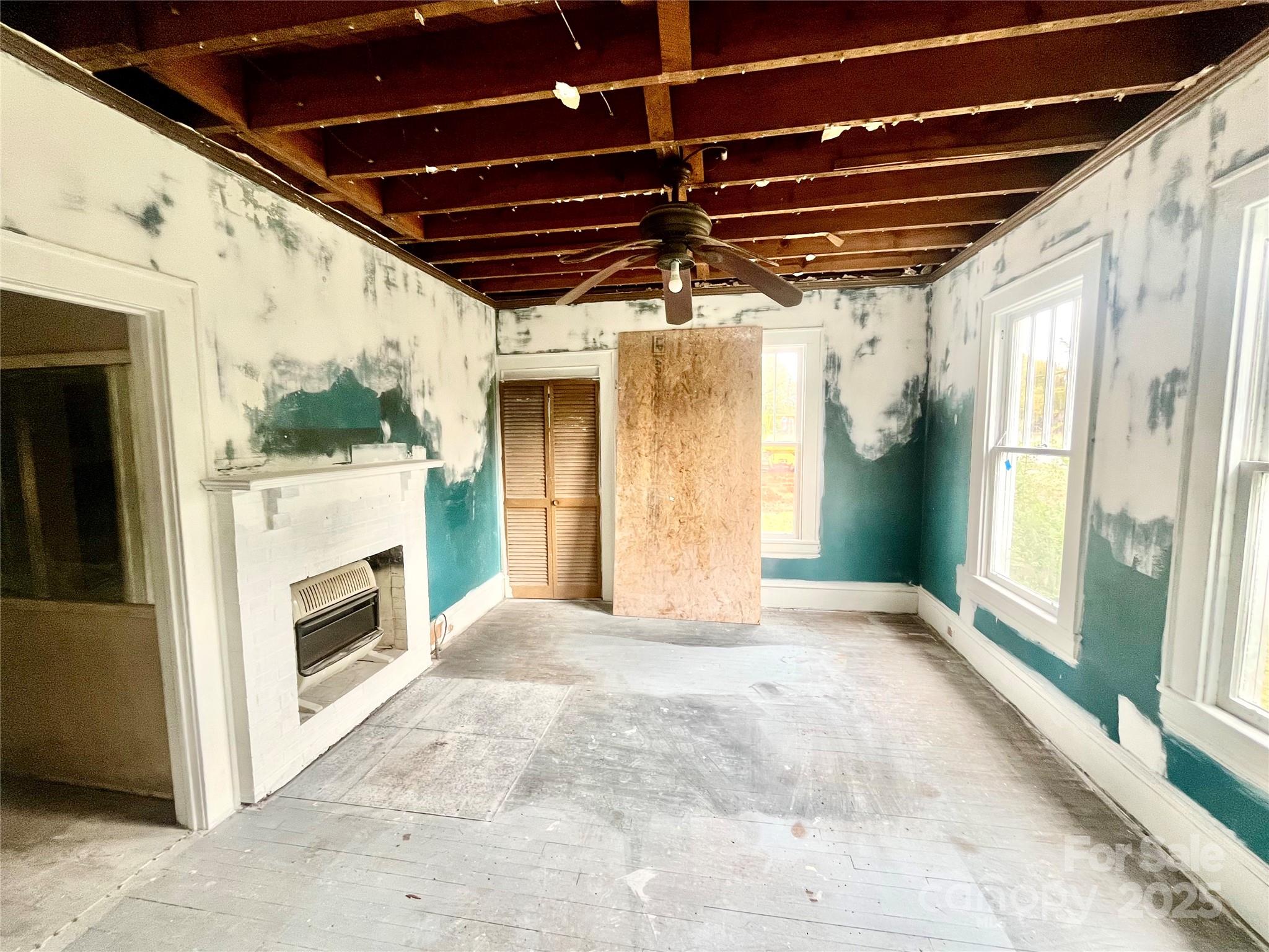 308 Elm Street Lancaster, SC 29720 - Photo 5 of 33 a view of an empty room with a fireplace