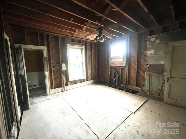 a view of an empty room with stairs
