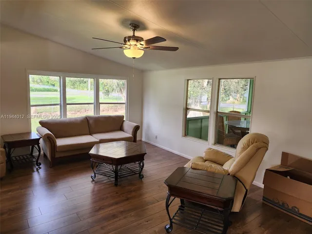 a living room with furniture and a large window