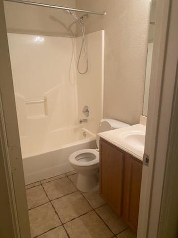 2217 Teddy Roosevelt Drive McKinney, TX 75072 - Photo 9 of 10 a bathroom with a granite countertop sink toilet and shower
