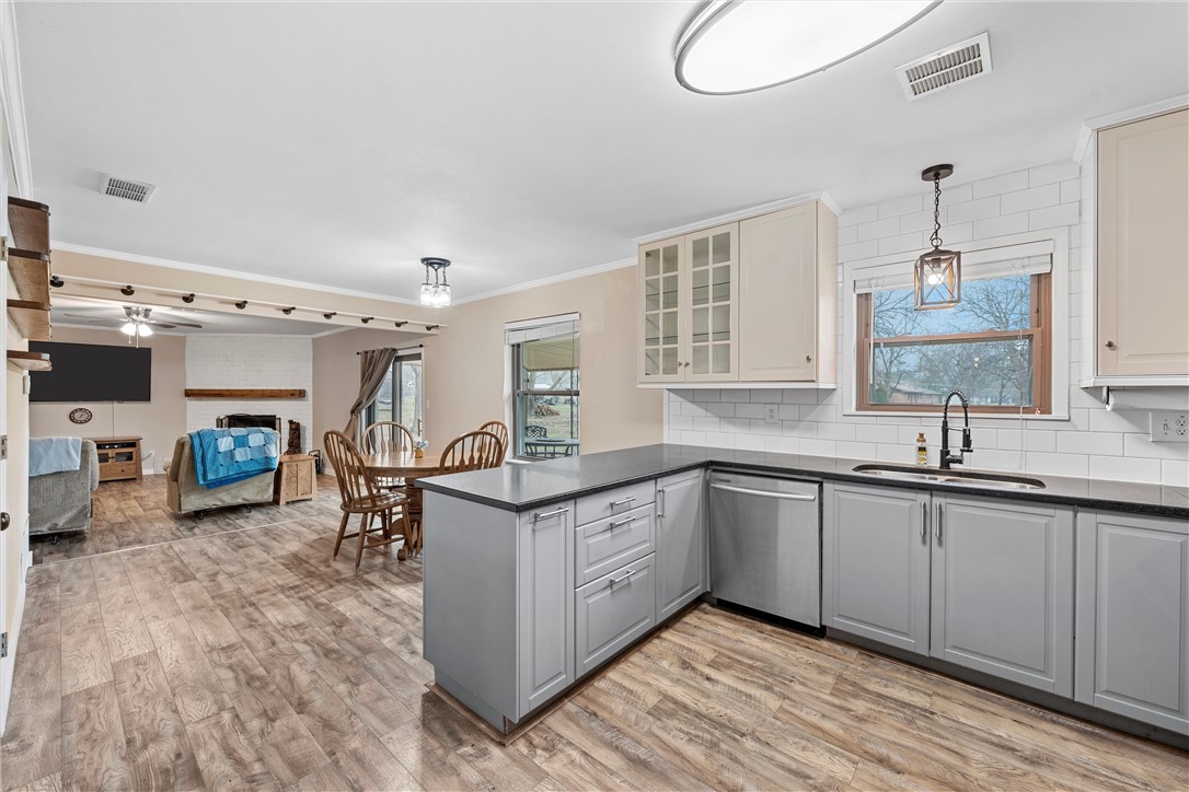 220 Ivy Lane Hewitt, TX 76643 - Photo 14 of 29 a kitchen with sink cabinets and stove top oven