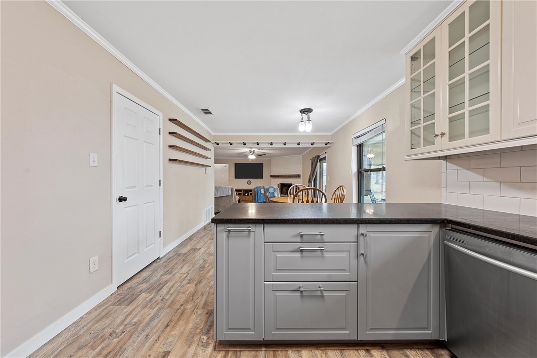 220 Ivy Lane Hewitt, TX 76643 - Photo 15 of 29 a kitchen with granite countertop a sink and cabinets