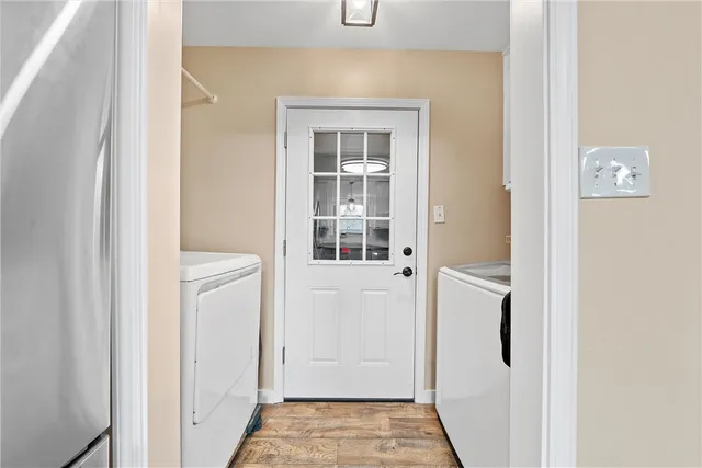 a view of a hallway with a wooden door