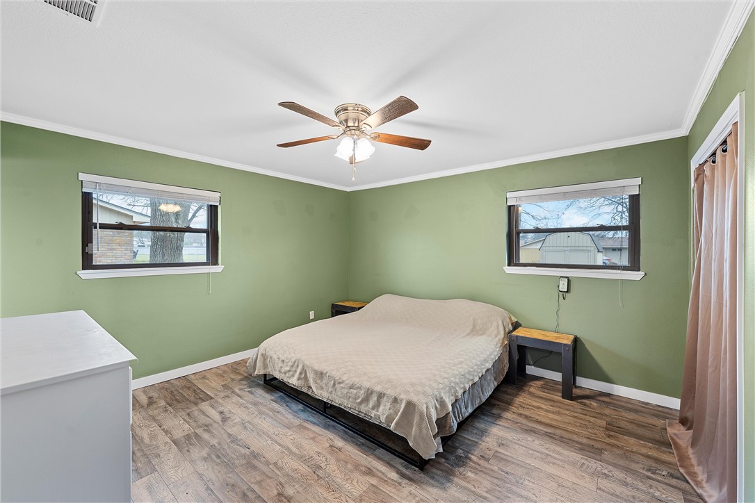 220 Ivy Lane Hewitt, TX 76643 - Photo 17 of 29 a bedroom with a bed and a table