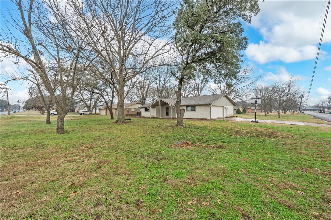 220 Ivy Lane Hewitt, TX 76643 - Photo 2 of 29 a view of a house with a yard