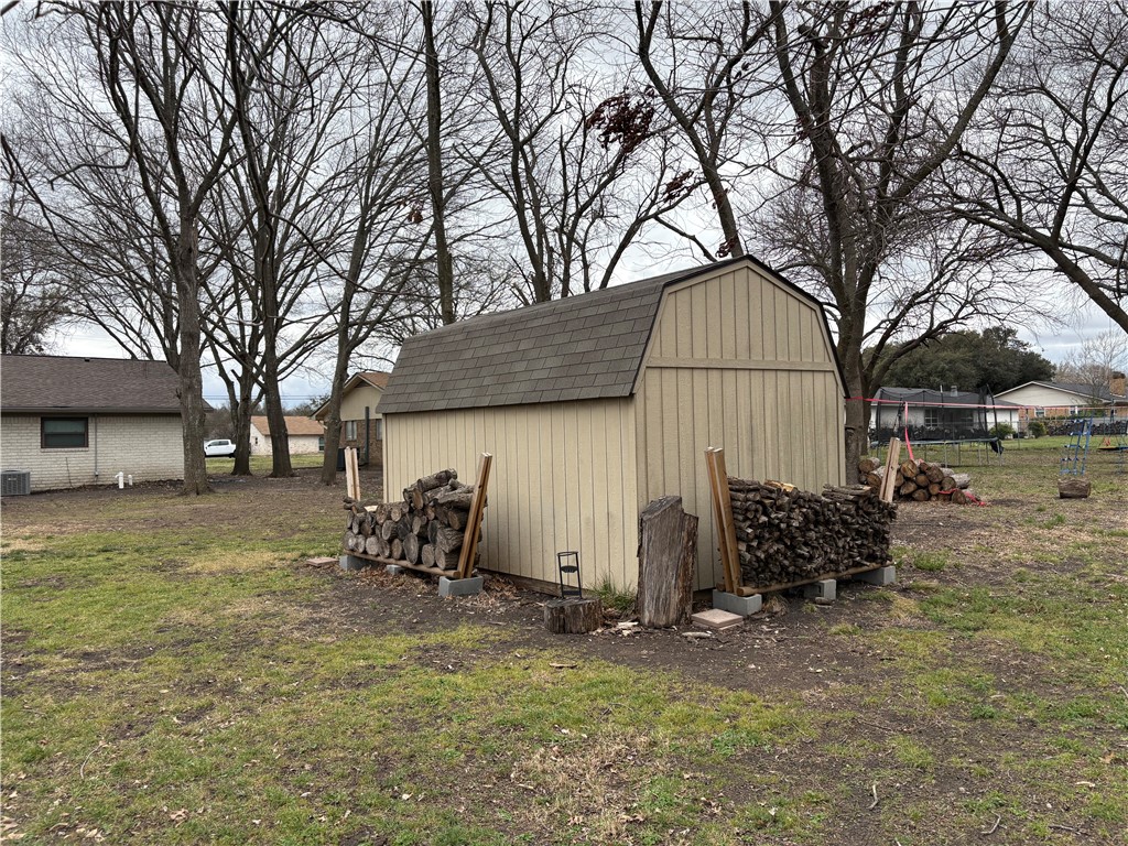 220 Ivy Lane Hewitt, TX 76643 - Photo 29 of 29 a view of backyard with wooden fence and large trees