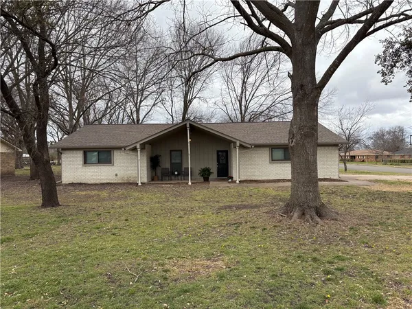 a house with trees in front of it