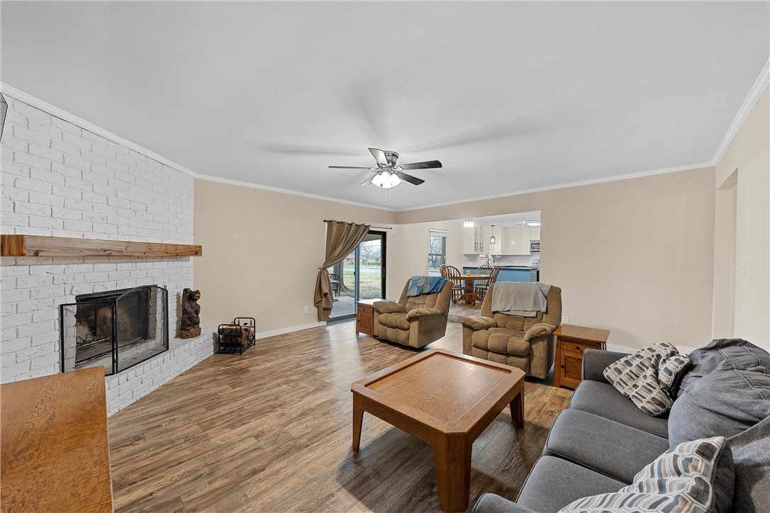 220 Ivy Lane Hewitt, TX 76643 - Photo 9 of 29 a living room with furniture and a fireplace