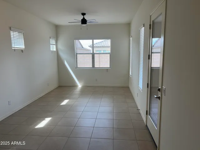 a kitchen with granite countertop wood cabinets and a microwave