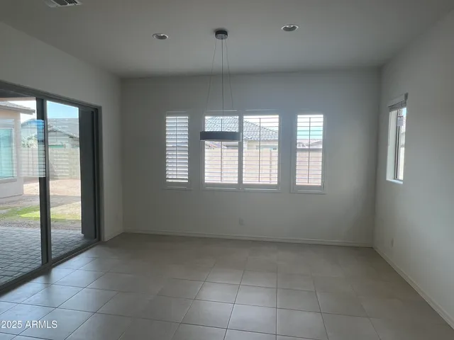 a kitchen with a refrigerator and a sink
