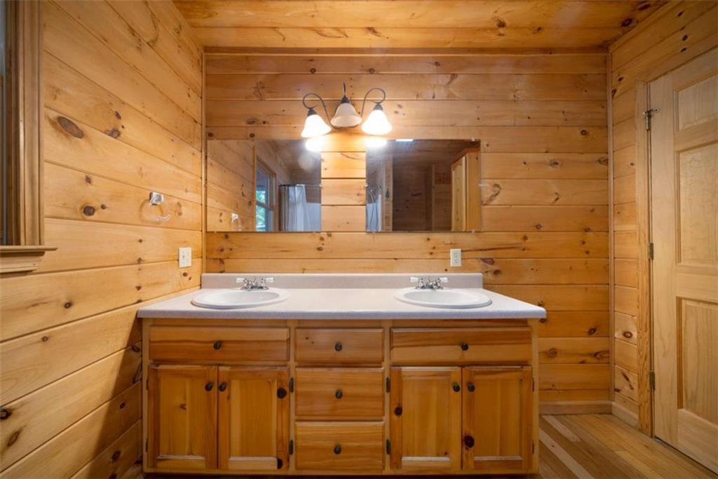 419 Blue Ridge Trail Morganton, GA 30560 - Photo 12 of 34 a bathroom with a sink and a mirror