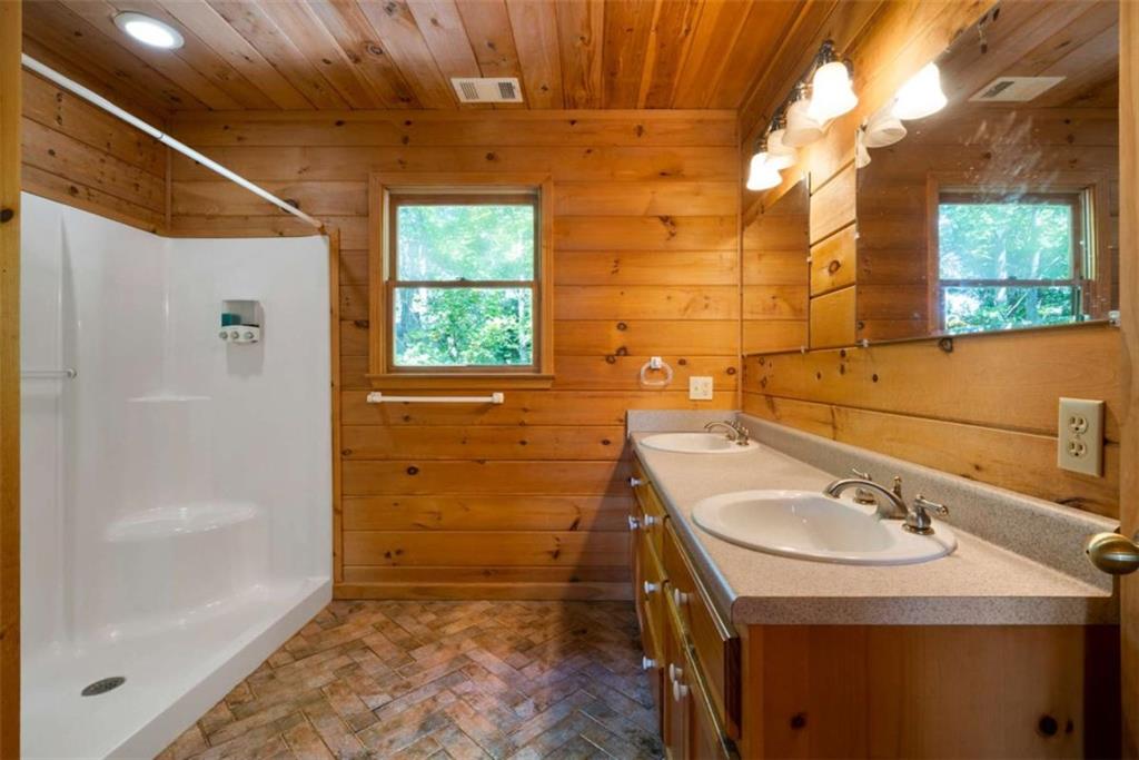 419 Blue Ridge Trail Morganton, GA 30560 - Photo 18 of 34 a bathroom with a sink a toilet and shower