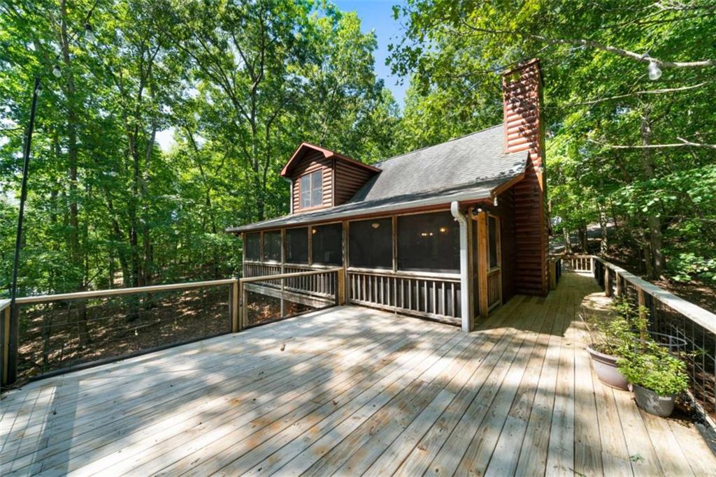 419 Blue Ridge Trail Morganton, GA 30560 - Photo 23 of 34 a view of house with outdoor space and sitting area
