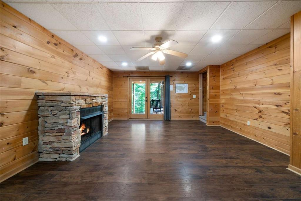 419 Blue Ridge Trail Morganton, GA 30560 - Photo 25 of 34 wooden floor in an empty room with a fireplace