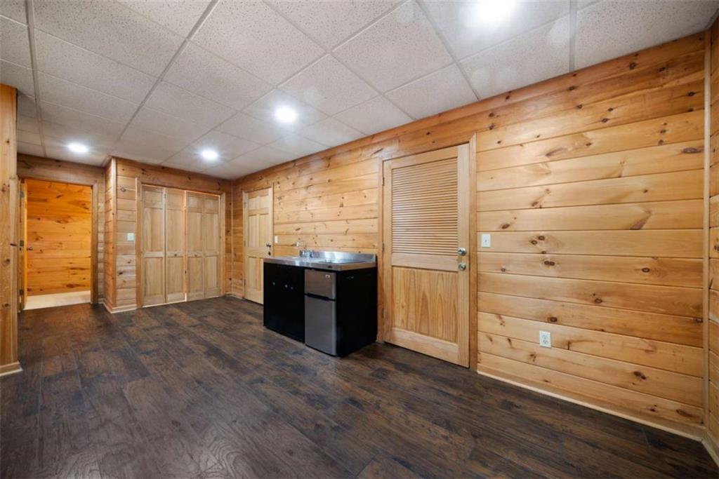 419 Blue Ridge Trail Morganton, GA 30560 - Photo 26 of 34 a view of an empty room with wooden floor and cabinet