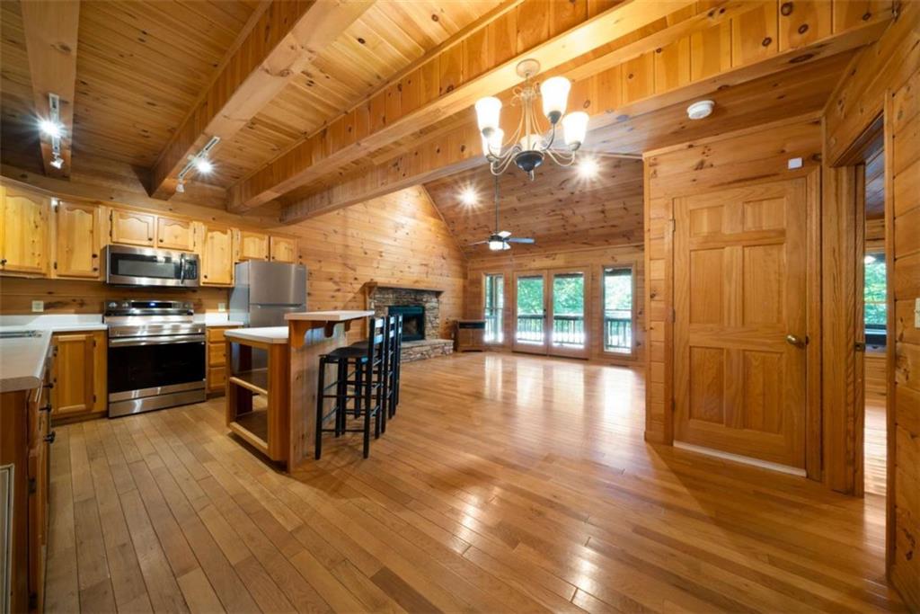419 Blue Ridge Trail Morganton, GA 30560 - Photo 3 of 34 a kitchen with a sink cabinets and wooden floor