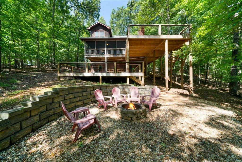 419 Blue Ridge Trail Morganton, GA 30560 - Photo 31 of 34 a view of a house with backyard sitting area and garden