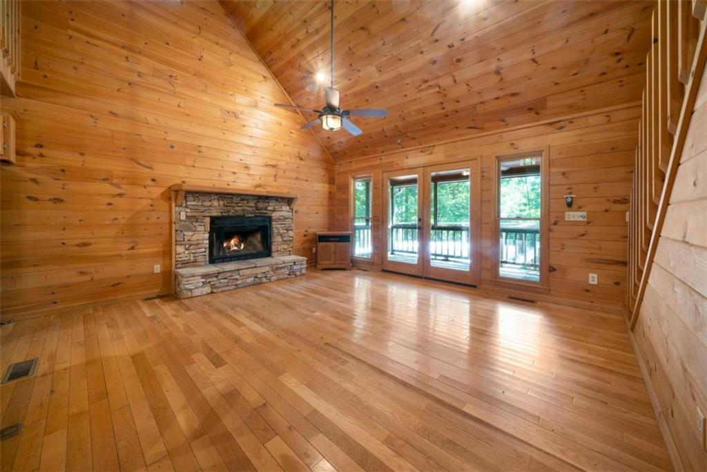 419 Blue Ridge Trail Morganton, GA 30560 - Photo 8 of 34 wooden floor fireplace and windows in an empty room