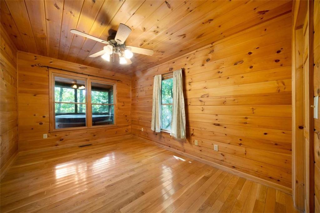 419 Blue Ridge Trail Morganton, GA 30560 - Photo 10 of 34 a view of empty room with wooden floor and fan