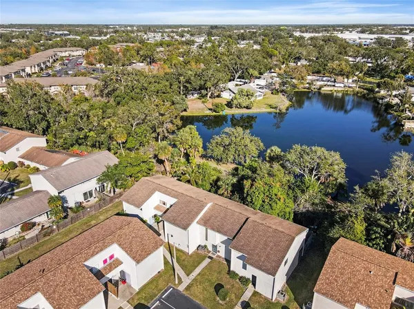 an aerial view of a house with a lake view