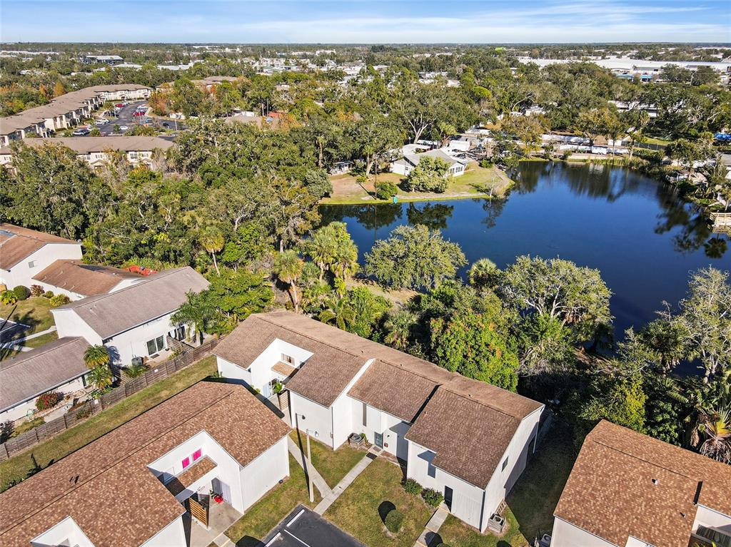 an aerial view of a house with a lake view