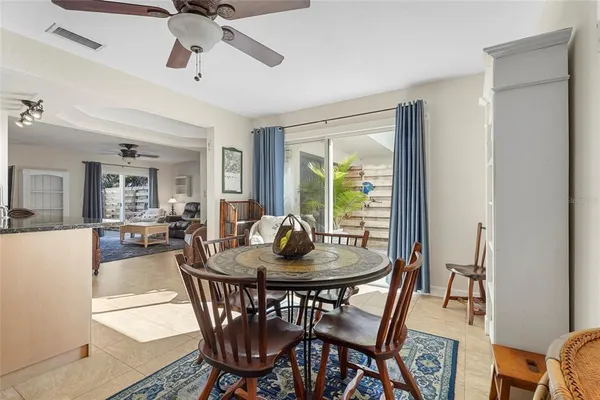 a kitchen with stainless steel appliances granite countertop a sink and a refrigerator