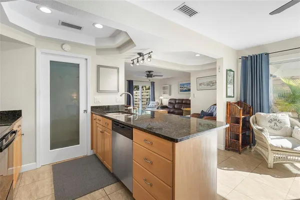 a kitchen with stainless steel appliances granite countertop a stove and a refrigerator
