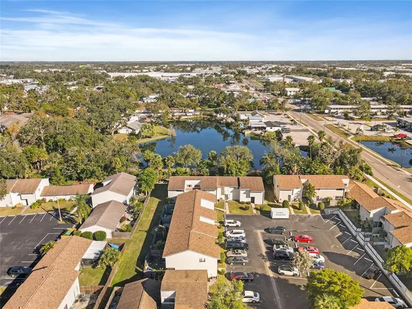 an aerial view of residential building and lake