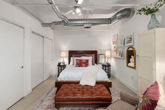 a bedroom with a bed and a walk in closet