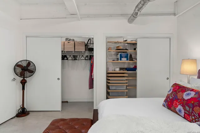 a bedroom with a bed and a dresser